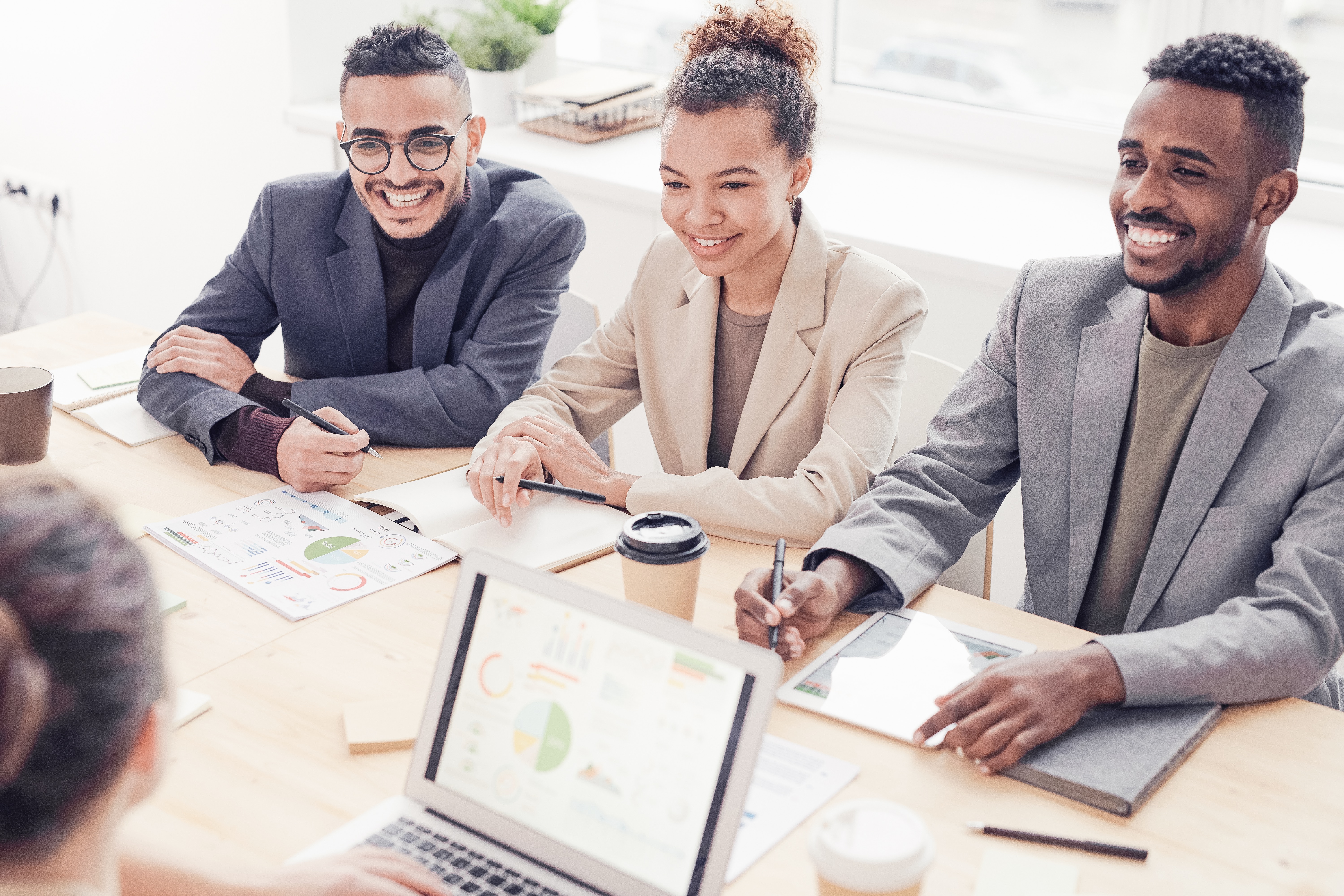 photo-of-three-people-smiling-while-having-a-meeting-3184338 2